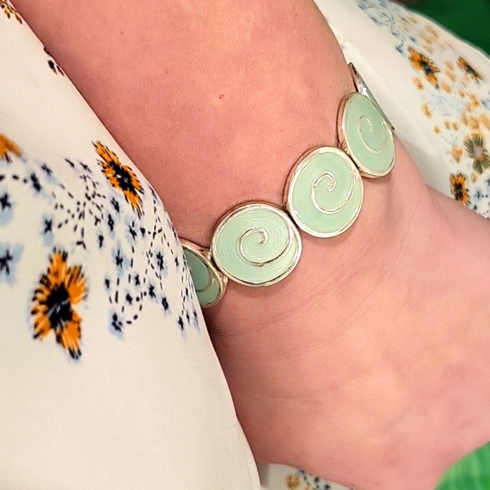 Tourquois bracelet with wave looking design in it. Costume jewelry from Ron Jon